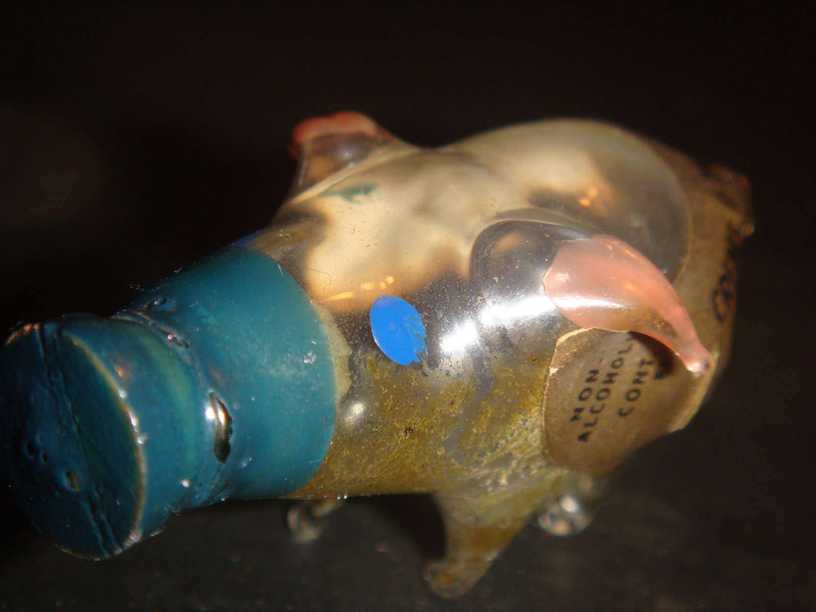 Creme de Menthe Cordial. Its ears and curly pig tail is pink