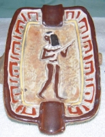 Egyptian playing a stringed instrument 